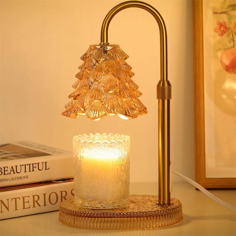 Hearthglow candle warmer lamp in amber finish glowing over a jar candle